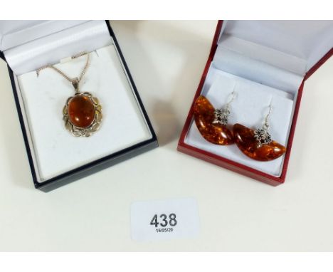 A silver and amber necklace and pair of silver and amber earrings