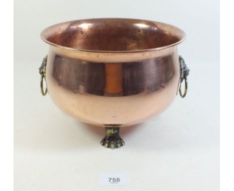 A copper planter on paw feet 16cm tall x 23cm diameter