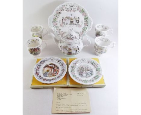 A group of Royal Doulton Brambly Hedge teaware comprising: four mugs, teapot, two boxed plates and a cake plate