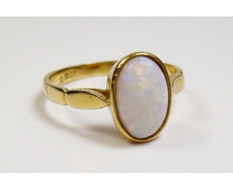 A 22 carat gold opal set ring - size S