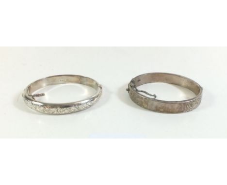 Two silver hinged bangles with engraved decoration