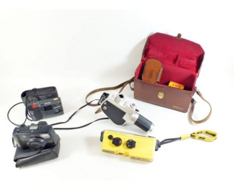 An Olympus Trip MD camera, a Pentax camera, a Minolta underwater camera and a Gevaert cine camera