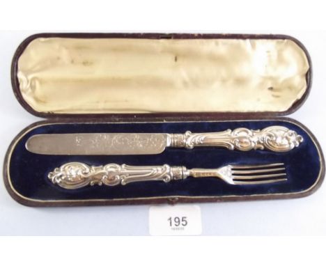 A Victorian silver knife and fork with embossed scrollwork decoration, by Aaron Hadfield, Sheffield 1869, cased