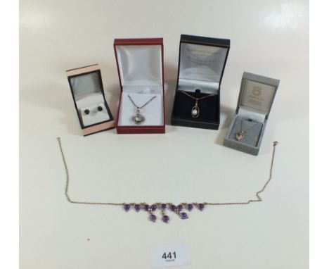 Four various silver necklaces and a pair of earrings