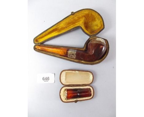 An amber and silver mounted pipe and a yellow metal mounted cheroot holder - both cased