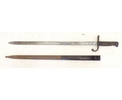 A WWI bayonet with scabbard and wooden handle