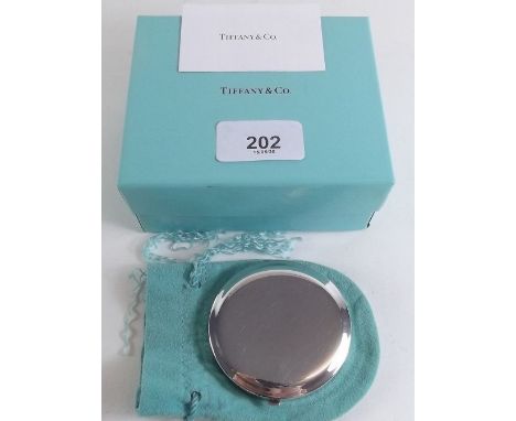 A Tiffany and Co silver compact - boxed, with bag etc