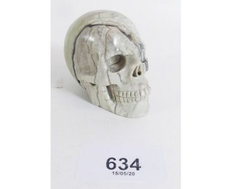 A carved butter jade skull - 5 x 6cm