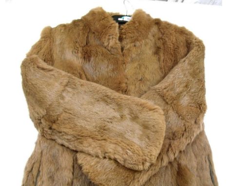 A fur coat and three stoles