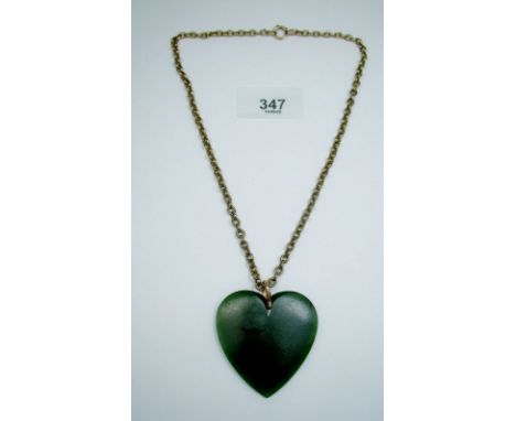 A 19th century jade heart pendant on 9 carat gold chain - chain 10g