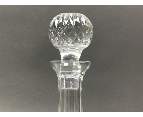 FOUR CRYSTAL DECANTERS AND OTHER CRYTSAL ITEMS  the decanters with stoppers, along with a crystal table lamp, various stopper