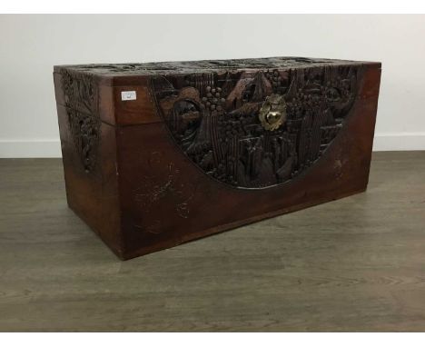 CHINESE CAMPHORWOOD BLANKET CHEST 20TH CENTURY richly carved with landscape scenery and figures105cm wide 