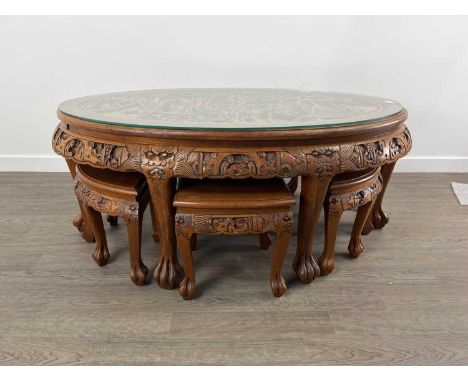 LARGE CHINESE CARVED TABLE 20TH CENTURY the top depciting a Chinese scene with figures and trees, along with six side tables 