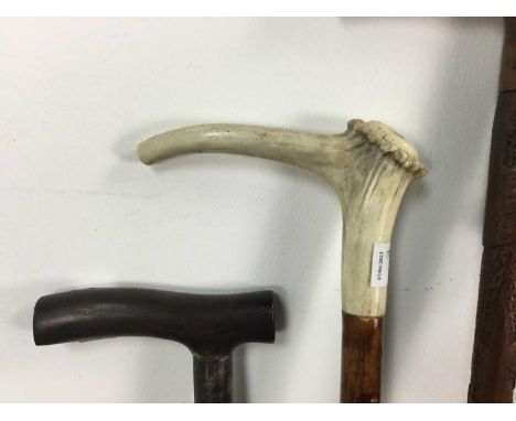 COLLECTION OF FIVE WALKING STICKS AND AN EPEE FENCING SWORD one walking stick featuring a silver plated top, another with a p
