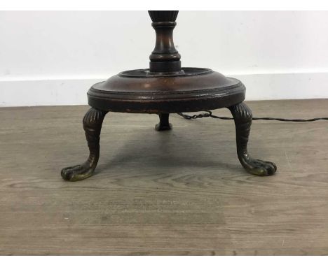 MAHOGANY STANDARD LAMP on three paw feet The lamp is in a good overall condition.&nbsp; We are unable to confirm if electrica