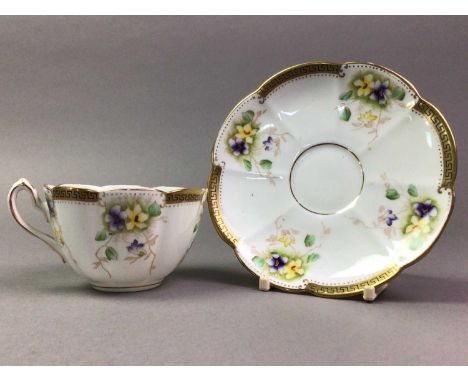 COURT CHINA TEA SERVICE comprising twelve trios, sugar and cream, decorated with flowers and gilt on a white ground