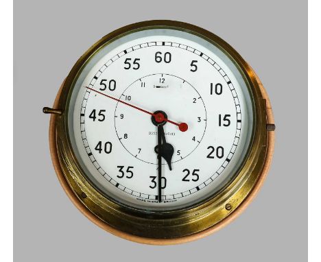 A brass ships bulkhead centre seconds timepiece, 8" painted dial, with military broad arrow mark and numbered 0552/461-9413, 