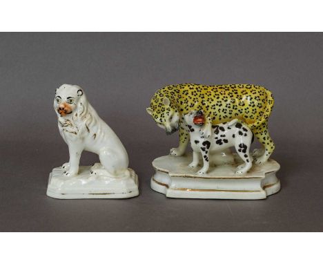 A Staffordshire porcelain Lloyd type model of a leopard and a spotted hound, circa 1830, raised on a moulded plinth, 8.25cm, 