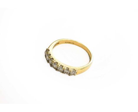 An 18 carat gold diamond seven stone ring, finger size P1/2Gross weight 3.9 grams.