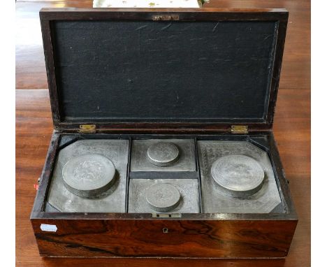 A Regency rosewood tea caddy, fitted with four compartments, containing Chinese pewter canisters, 41cm wide