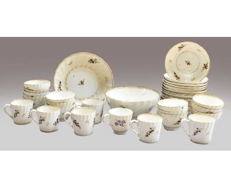 An English Porcelain Tea and Coffee Service, circa 1795, of wrythen fluted form, painted in black and gilt with flower sprigs