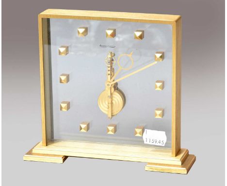 A Jaeger LeCoultre brass mantel timepieceBrass case is slightly discoloured in parts, front glass with signature slightly rub