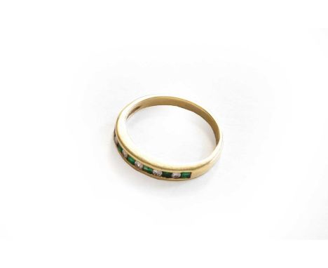 A emerald and diamond half hoop ring, stamped '14Kt', finger size LGross weight 2.1 grams.