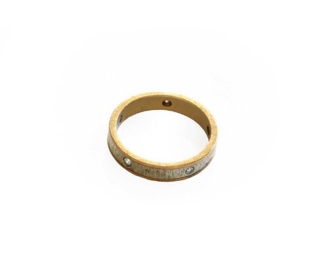 A 9 carat gold band ring, inset with five diamonds, finger size K1/2Gross weight 2.8 grams.