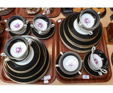 A Royal Worcester matt black ground part dinner service, printed in a monochrome puce with fruit, comprising twelve dinner pl