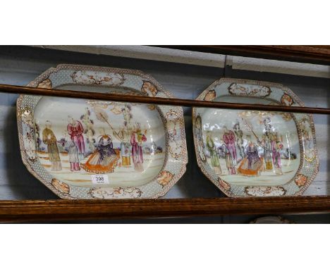 A pair of Chinese canted rectangular tureen stands, Qianlong, each painted in coloured enamels with a dignitary and attendant