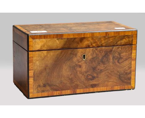 A Victorian tea caddy, figured walnut crossbanded in tulipwood, with fitted interior, a pair of compartments and glass mixing