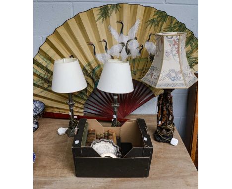 An oversized Oriental silk fan painted with cranes, a Chinese style figural plaster table lamp, a pair of white metal Corinth