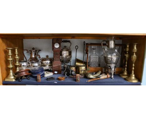 A four-piece silver plated tea service, a three-bottle oak tantalus, two pairs of Victorian brass candlesticks, plated spirit