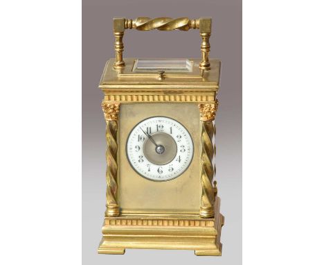 A brass striking and repeating carriage clock, circa 1900, Corinthean capped side columns, carrying handle and repeat button,