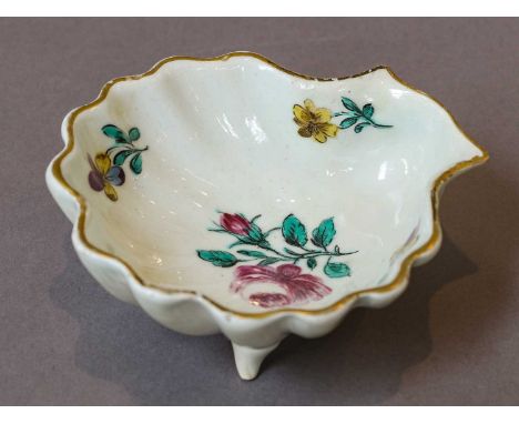 A Bow shell moulded pickle dish, circa 1755, painted in coloured enamels with flower sprigs and with gilt rim, painted anchor