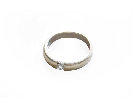 A diamond solitaire ring, stamped '750', finger size MGross weight 4.0 grams.