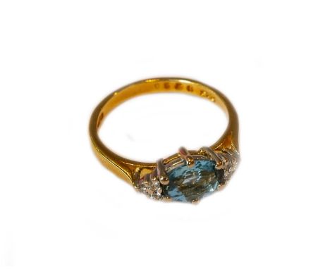 An 18 carat gold aquamarine and diamond ring, finger size K1/2Gross weight 3.1 grams.