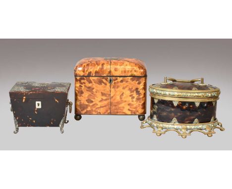A tortoiseshell tea caddy, 19th century, with white metal mounts and raised on scrolling feet, together with another blonde t