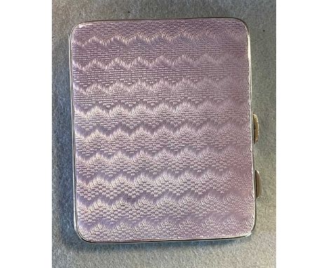 A silver and enamel pocket cigarette case, decorated on both sides with lilac guilloché enamel, sprung loaded catch, piano hi