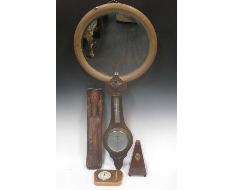 An aneroid barometer, another barometer, a metronome, a wood carving of Christ and a pine oval mirror (5)