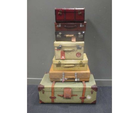 Collection of 6 leather and other suitcases, including one miniature cabin trunk and one vellum case (7)
