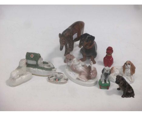 Model dogs. KPM dog on oval base, Royal Worcester bull dog, Rosenthal spaniel, 3 others, a sheep, composite dachshund and woo