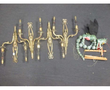 Four 20th centuryNeo-classical style two branch wall lights with ribbon cresting together with a dragon puppet and a small ba