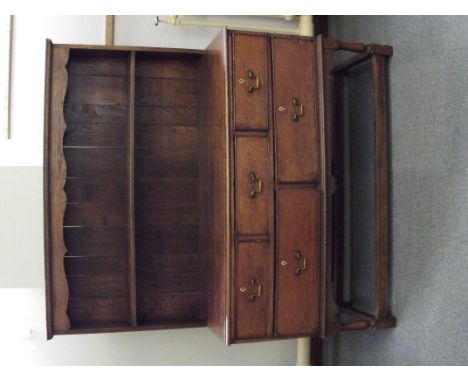 Georgian oak dresser of small proportion, shaped frieze over a single shelf rack, three short drawers over two long drawers, 