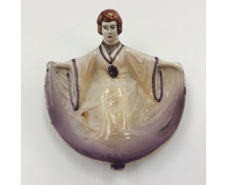 An Art Deco figural trinket tray, in the form of a lady lying down, hand painted, stamped British 