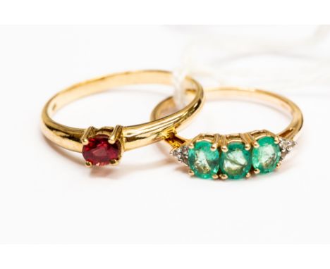 A 9ct gold ruby ladies dress ring, ring size T½; together with an emerald and diamond dress ring, ring size O, with a combine