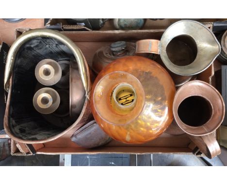 A collection of copper including jugs, coal scuttle, oil lamp with amber glass shade, etc 
