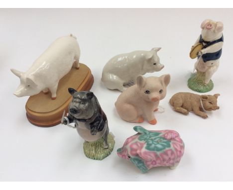 A Royal Doulton model of a pig, together with a Beswick pig 'Andrew' and five other ceramic pigs (7)