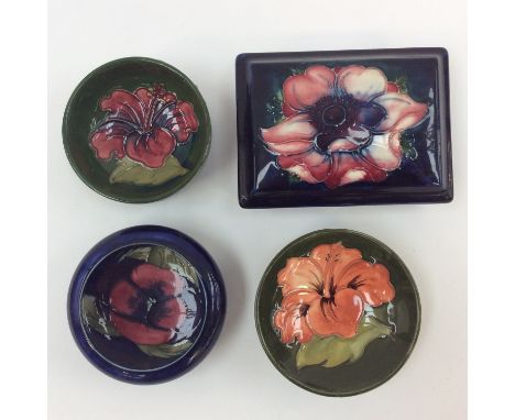 A Moorcroft trinket box and cover (seconds and repaired) with three further trinket bowls (one seconds) (4) 