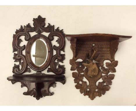 Black Forest carved bracket shelves, including stags head and hall mirror (2) 